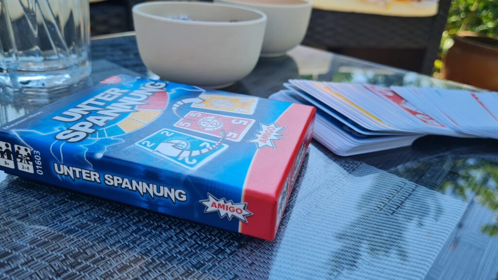 vier Spiele für einen Spieleabend im Sommer von amigo spiele: unter spannung